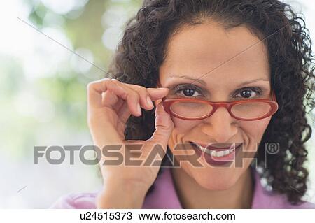 Stock Image - Woman working in office. Fotosearch
