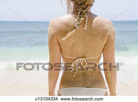 Woman's back with sticking sand View Large Photo Image Picture - Woman's back with sticking sand . Fotosearch