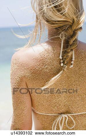 Woman's back with sticking sand View Large Photo Image Stock Image - Woman's back with sticking sand . Fotosearch