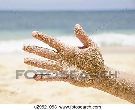 Woman's hand with sticking sand View Large Photo Image Stock Image - Woman's hand with sticking sand . Fotosearch