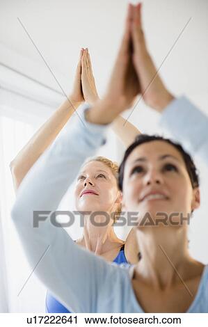 Women during yoga class View Large Photo Image Stock Image - Women during yoga class. Fotosearch
