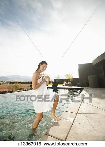 Young attractive woman emerging from swimming pool View Large Photo Image Stock Photograph - Young attractive woman emerging from swimming pool. Fotosearch