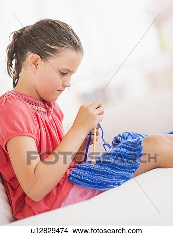 Young girl (8-9) knitting View Large Photo Image Picture - Young girl (8-9) knitting . Fotosearch