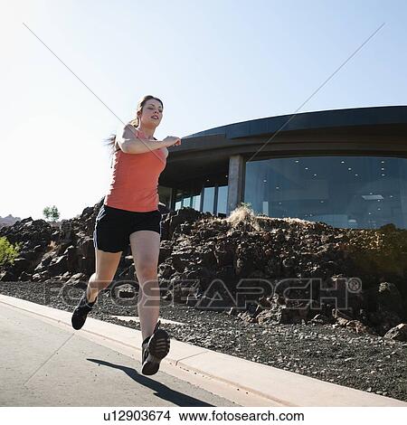 Young woman jogging View Large Photo Image Picture - Young woman jogging. Fotosearch