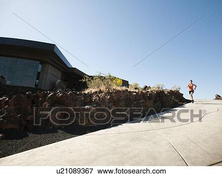 Young woman jogging View Large Photo Image Stock Photo - Young woman jogging. Fotosearch