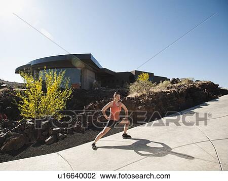 Young woman stretching View Large Photo Image Stock Image - Young woman stretching. Fotosearch