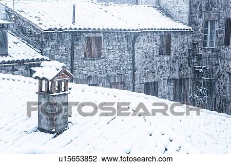 Aerial view of medieval street - stone houses and tiled roofs, covered with snow in early dawn light, MonteCastello di Vibio, Umbria, Italy View Large Photo Image Stock Image - Aerial view of medieval street - stone houses and tiled roofs, covered with snow in early dawn light, MonteCastello di Vibio, Umbria, Italy. Fotosearch