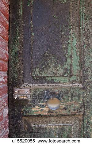 Ancient wooden panelled door with peeling and blistered paint, surrounding red brick wall, medieval village, Umbria, Italy View Large Photo Image Stock Photography - Ancient wooden panelled door with peeling and blistered paint, surrounding red brick wall, medieval village, Umbria, Italy. Fotosearch