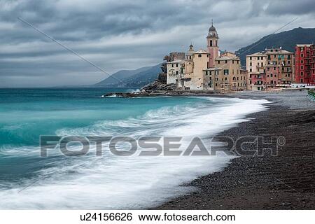 Camogli: beach and sea with waves motion blur, church tower and surrounding buildings beyond, grey sky with dramatic clouds, Liguria, Italy View Large Photo Image Stock Photograph - Camogli: beach and sea with waves motion blur, church tower and surrounding buildings beyond, grey sky with dramatic clouds, Liguria, Italy. Fotosearch