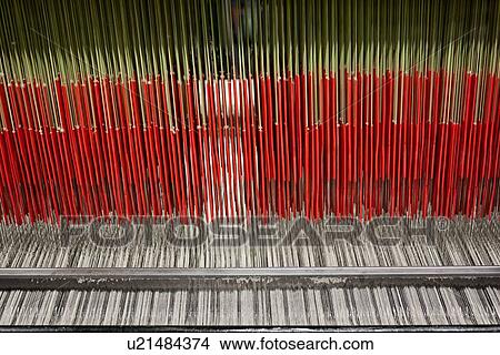 Close up view of Jacquard loom with pattern formed by green and red linen and cotton threads attached to heddle, Umbria, Italy View Large Photo Image Picture - Close up view of Jacquard loom with pattern formed by green and red linen and cotton threads attached to heddle, Umbria, Italy. Fotosearch