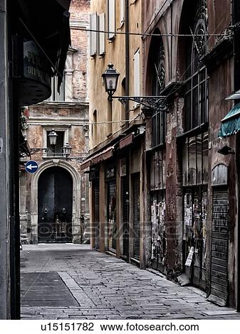 Deserted street in Historic Centre of Bologna with crumbling stone facades and brickwork leading to old palazzo doorway, Bologna, Italy View Large Photo Image Stock Image - Deserted street in Historic Centre of Bologna with crumbling stone facades and brickwork leading to old palazzo doorway, Bologna, Italy. Fotosearch