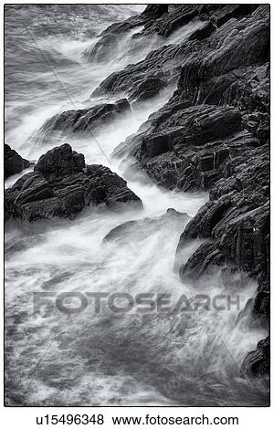 Detail of heavy seas smashing against rocks, with motion blur, monochrome image, Cinque Terre, Italy View Large Photo Image Stock Photo - Detail of heavy seas smashing against rocks, with motion blur, monochrome image, Cinque Terre, Italy. Fotosearch
