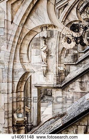 Detail of Milan Duomo rooftop: series of rooftop flying buttresses, elaborate stone carving, aerial desaturated view, Milan Italy, View Large Photo Image Stock Photo - Detail of Milan Duomo rooftop: series of rooftop flying buttresses, elaborate stone carving, aerial desaturated view, Milan Italy,. Fotosearch