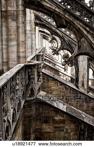 Detail of Milan Duomo rooftop: series of rooftop flying buttresses, elaborate stone carving, desaturated view, Milan Italy, View Large Photo Image Stock Photo - Detail of Milan Duomo rooftop: series of rooftop flying buttresses, elaborate stone carving, desaturated view, Milan Italy,. Fotosearch