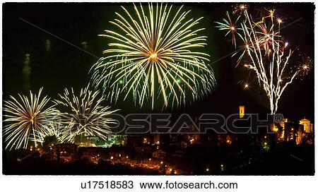 Stock Image - Fireworks in the night sky over medieval hilltop town of MonteCastello di Vibio, Umbria, Italy. Fotosearch