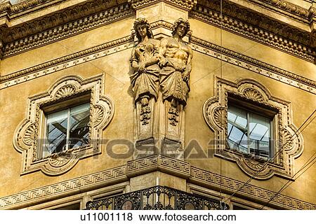 Stock Photo - Gallerica Vittorio Emanuele: close up detail view of central mall area facade with stone carving statues, Milan Italy. Fotosearch