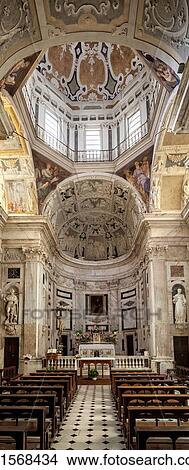Picture - Genoa Centro Storico: Church of San Pietro in Bianchi vetical panorama view of central nave leading to altar and monochrome apse with bas relief figures, ornate decoration, richly embellished stucco ceiling and cupola, Genova, Italy. Fotosearch