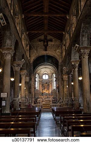 Genoa Centro Storico: Church of San Donato central nave leading to altar in Romanesque Church of stone with Corinthian columns on each side, Genova, Italy View Large Photo Image Stock Image - Genoa Centro Storico: Church of San Donato central nave leading to altar in Romanesque Church of stone with Corinthian columns on each side, Genova, Italy. Fotosearch