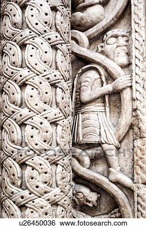 Genoa Centro Storico: Duomo of San Lorenzo, detail of marble carved column of facade, figure of a man, intertwined pattern and garlands, Genova, Italy View Large Photo Image Stock Photograph - Genoa Centro Storico: Duomo of San Lorenzo, detail of marble carved column of facade, figure of a man, intertwined pattern and garlands, Genova, Italy. Fotosearch