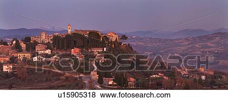 Hilltop medieval town of MonteCastello di Vibio in sunset light church and campanile, snowcapped mountains and hills beyond, Umbria, Italy View Large Photo Image Stock Photo - Hilltop medieval town of MonteCastello di Vibio in sunset light church and campanile, snowcapped mountains and hills beyond, Umbria, Italy. Fotosearch