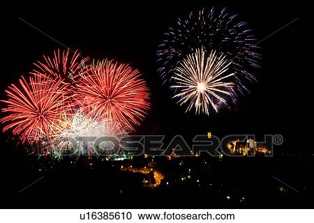 Huge display of fireworks exploding over medieval hiiltop town of MonteCastello di Vibio, with campanile and church lit up at night, Umbria, Italy View Large Photo Image Stock Image - Huge display of fireworks exploding over medieval hiiltop town of MonteCastello di Vibio, with campanile and church lit up at night, Umbria, Italy. Fotosearch