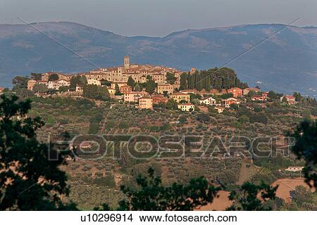 Medieval hilltop town of MonteCastello di Vibio at sunset, with background of hills beyond the Tiber valley, Umbria, Italy View Large Photo Image Picture - Medieval hilltop town of MonteCastello di Vibio at sunset, with background of hills beyond the Tiber valley, Umbria, Italy. Fotosearch
