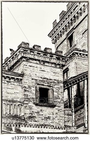 Stock Image - Montefalco: medieval brick palazzo with two towers and external wooden staircase, traditional Gothic architecture, monochrome detail, Umbria, Italy. Fotosearch