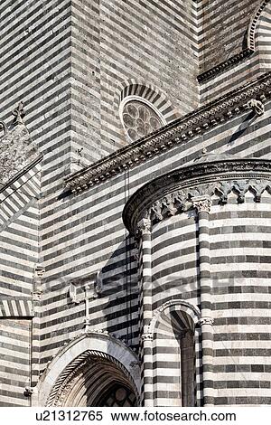 Stock Photography - Orvieto Duomo - detail of side wall with black and white striped stone, curved walls and decorations causing dramatic patterned effect, Romanesque-Gothic style, Umbria, Italy. Fotosearch