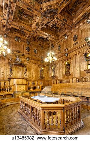 Palazzo Archigennasio: anatomy lecture theatre with ornate carved ceiling representing signs of the zodiac, wooden statues above wooden lecture benches, and central white marble dissection table, Bologna, Italy View Large Photo Image Stock Image - Palazzo Archigennasio: anatomy lecture theatre with ornate carved ceiling representing signs of the zodiac, wooden statues above wooden lecture benches, and central white marble dissection table, Bologna, Italy. Fotosearch