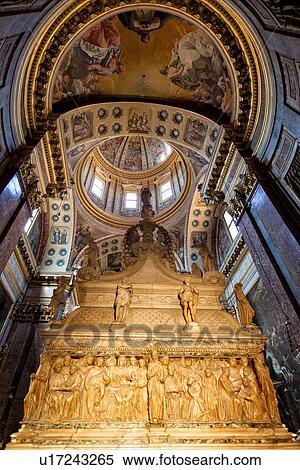 Stock Photography - San Domenico church, Baroque style: chapel of San Domenico with ornately carved marble Arca and frescoed cupola and arched ceiling beyond, Bologna, Italy. Fotosearch