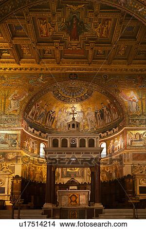 Picture - Santa Maria in Trastevere: interior detail of apse completely decorated with 13th century Cavallini mosaics, with baldacchino altar, and richly decorated gilt coffered ceiling, Rome, Italy. Fotosearch