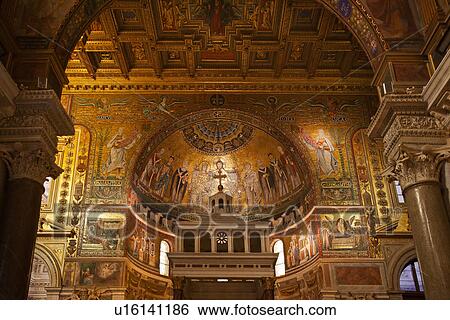 Stock Photograph - Santa Maria in Trastevere: interior detail of apse completely decorated with 13th century Cavallini mosaics, with adjacent Corinthian columns, and richly decorated gilt coffered ceiling, Rome, Italy. Fotosearch