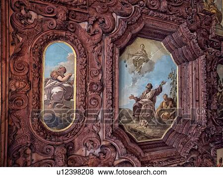 Stock Photo - Scuola Grande dei Carmini: detail of ornate wooden carved decoration around frescoed ceiling panels, Venice, Italy. Fotosearch