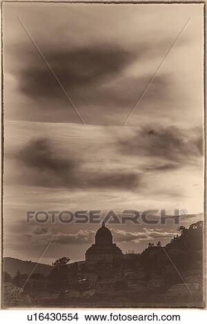 Picture - Tempio: Santa Maria della Consolazione, Todi at sunset with dramatic sky, stylised monochrome image, Umbria, Italy. Fotosearch