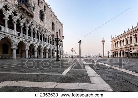 The Doge's Palace at dawn with empty Piazzetta, column with lion of San Marco, view to San Giorgio Maggiore beyond, Venice, Italy View Large Photo Image Stock Image - The Doge's Palace at dawn with empty Piazzetta, column with lion of San Marco, view to San Giorgio Maggiore beyond, Venice, Italy. Fotosearch
