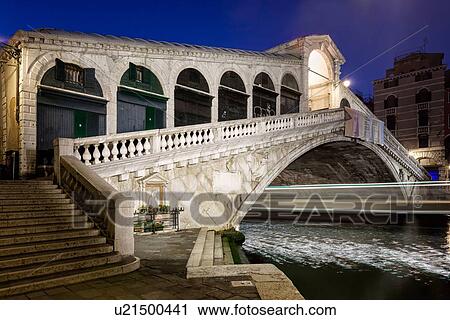 The Rialto bridge at night, with the lights of a boat speeding through, Venice, Italy View Large Photo Image Stock Image - The Rialto bridge at night, with the lights of a boat speeding through, Venice, Italy. Fotosearch
