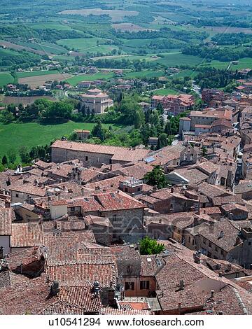 Todi: aerial view of red tiled rooftops, Santa Maria della Consolazione Tempio and Tiber valley beyond, on lovely spring morning, Umbria, Italy View Large Photo Image Picture - Todi: aerial view of red tiled rooftops, Santa Maria della Consolazione Tempio and Tiber valley beyond, on lovely spring morning, Umbria, Italy. Fotosearch