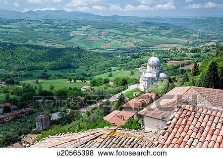 Todi: aerial view of red tiled rooftops, Santa Maria della Consolazione Tempio and Tiber valley beyond, on lovely spring morning, Umbria, Italy View Large Photo Image Stock Photo - Todi: aerial view of red tiled rooftops, Santa Maria della Consolazione Tempio and Tiber valley beyond, on lovely spring morning, Umbria, Italy. Fotosearch