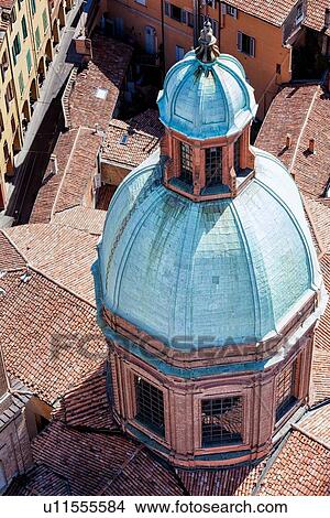 View from Torre Asinelli of Bologna looking at detail of church of San Bartolomeo e Gaetano green dome and red-tiled roofs reflected in its windows, with portico of Via San Vitale beyond, Bologna, Italy View Large Photo Image Picture - View from Torre Asinelli of Bologna looking at detail of church of San Bartolomeo e Gaetano green dome and red-tiled roofs reflected in its windows, with portico of Via San Vitale beyond, Bologna, Italy. Fotosearch
