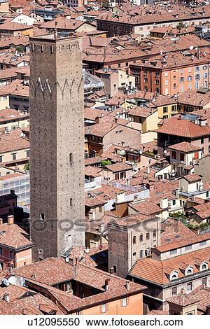 Stock Image - View from Torre Asinelli of Bologna looking over the red-tiled roofs of the city to Torre Prendiparte, Bologna, Italy. Fotosearch