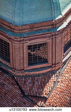View from Torre Asinelli of Bologna looking at detail of church of San Bartolomeo e Gaetano green dome and red-tiled roofs reflected in its windows, Bologna, Italy View Large Photo Image Stock Image - View from Torre Asinelli of Bologna looking at detail of church of San Bartolomeo e Gaetano green dome and red-tiled roofs reflected in its windows, Bologna, Italy. Fotosearch