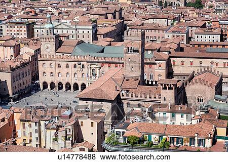 Stock Photo - View from Torre Asinelli of Bologna towards Piazza Maggiore with Palazzo del Podesta, Palazzo Re Enzo, Torre dell'Arengo, Palazzo d'Accursio with clock tower, and the red tiled roofs of the city, Bologna, Italy. Fotosearch