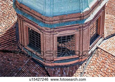 View from Torre Asinelli of Bologna looking at detail of church of San Bartolomeo e Gaetano green dome and red-tiled roofs reflected in its windows, Bologna, Italy View Large Photo Image Stock Photograph - View from Torre Asinelli of Bologna looking at detail of church of San Bartolomeo e Gaetano green dome and red-tiled roofs reflected in its windows, Bologna, Italy. Fotosearch