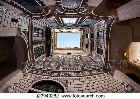 View looking straight upwards in courtyard of palazzo, decorated entirely with faux architectural trompe d'oeil designs of French windows, brick, balconies from floor to ceiling, open to blue sky, Rome, Italy View Large Photo Image Stock Image - View looking straight upwards in courtyard of palazzo, decorated entirely with faux architectural trompe d'oeil designs of French windows, brick, balconies from floor to ceiling, open to blue sky, Rome, Italy. Fotosearch