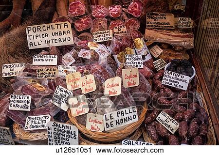 View of mahogany panelled shop window and doorway with salami, sausages, truffles, cinghiale, cheeses, wines all displayed in baskets, Umbria, Italy View Large Photo Image Stock Image - View of mahogany panelled shop window and doorway with salami, sausages, truffles, cinghiale, cheeses, wines all displayed in baskets, Umbria, Italy. Fotosearch