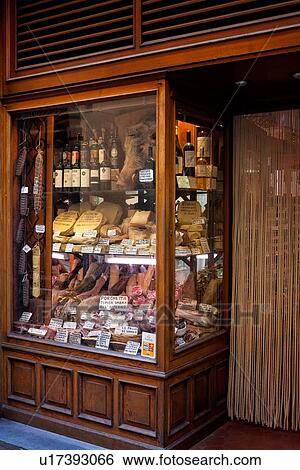 View of mahogany panelled shop window and doorway with salami, sausages, truffles, cinghiale, cheeses, wines all displayed in baskets, Umbria, Italy View Large Photo Image Stock Photograph - View of mahogany panelled shop window and doorway with salami, sausages, truffles, cinghiale, cheeses, wines all displayed in baskets, Umbria, Italy. Fotosearch