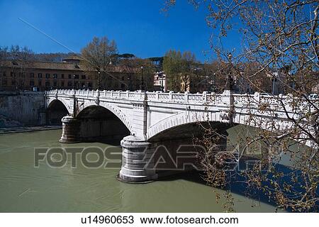 View of Ponte Mazzini, with three arches of white stone spanning River Tiber, street and trees beyond in early spring, sunny blue sky, Rome Italy View Large Photo Image Stock Image - View of Ponte Mazzini, with three arches of white stone spanning River Tiber, street and trees beyond in early spring, sunny blue sky, Rome Italy. Fotosearch