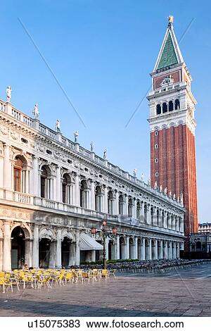 View of the Piazzetta at dawn, with one person sitting in the open cafe, empty yellow chairs, Campanile and Archaeology Museum building, Venice, Italy View Large Photo Image Stock Image - View of the Piazzetta at dawn, with one person sitting in the open cafe, empty yellow chairs, Campanile and Archaeology Museum building, Venice, Italy. Fotosearch