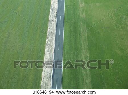 Picture - Aerial view of rural fields and road. Fotosearch