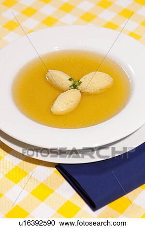Bowl of broth with dumplings View Large Photo Image Stock Image - Bowl of broth with dumplings. Fotosearch